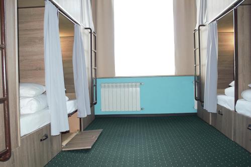 Ένα ή περισσότερα κρεβάτια σε δωμάτιο στο All Eyes Hostel