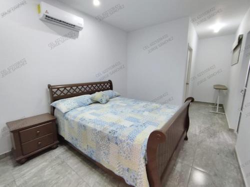 a bedroom with a bed in a white room at Casa Cosmos 'Alberca Privada' in San Carlos