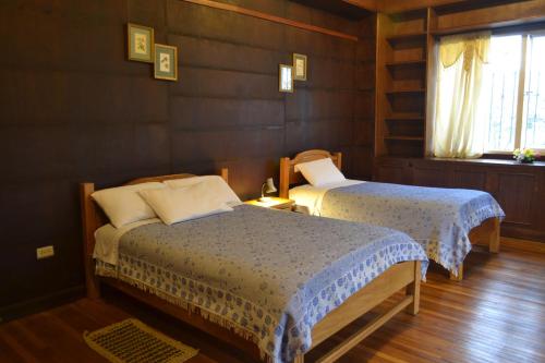 Postel nebo postele na pokoji v ubytování Travellers Inn