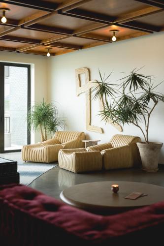 a living room with two couches and a number on the wall at Drift Nashville, a Member of Design Hotels in Nashville