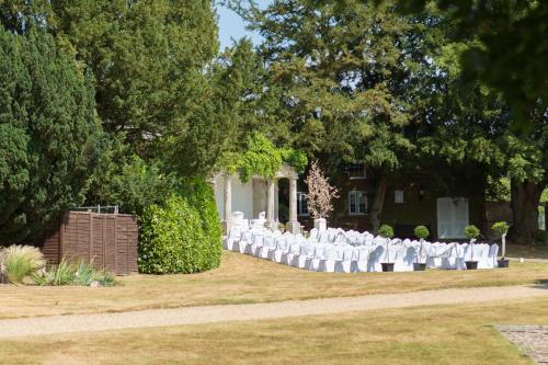 a set up for a wedding in front of a house at Highfield Park in Hook