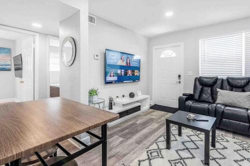 a living room with a couch and a table at Mazor Luxury Two bedroom vacation Home in Fort Lauderdale