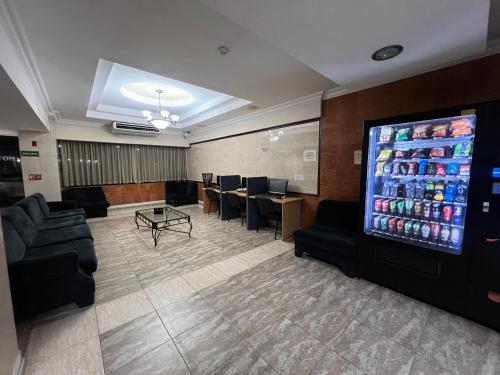 a waiting room with a large drink vending machine at Eurohotel in Panama City