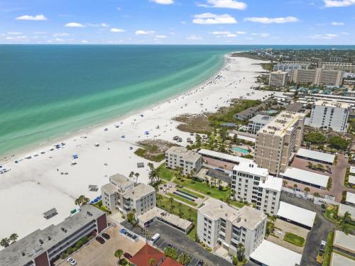 an aerial view of a beach with buildings and the ocean at Island House Beach Resort 40B in Siesta Key