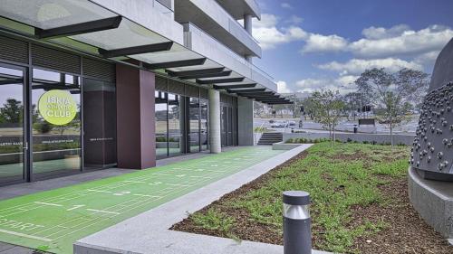 a building with a walkway in front of a building at Canberra Chic I30 in Campbell
