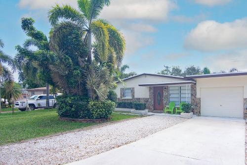 a palm tree in front of a house at Luxury home in Fort Lauderdale