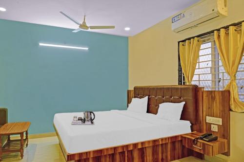 Voodi või voodid majutusasutuse Collection O 87127 City Residency Near Sri Lakshmi Narasimha Swamy Temple toas