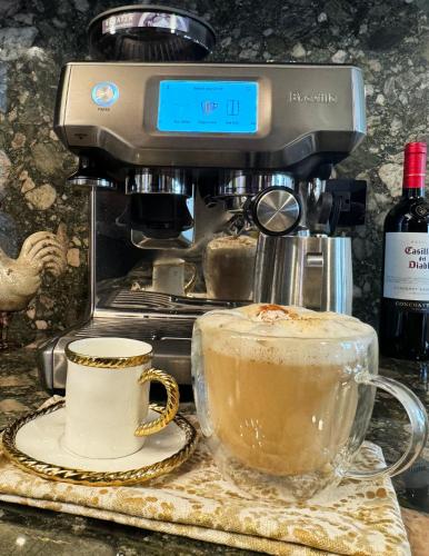 a coffee maker with a cup of coffee on a counter at Ocean Luxe in Paradise - Le Paradis Royal in Rincon