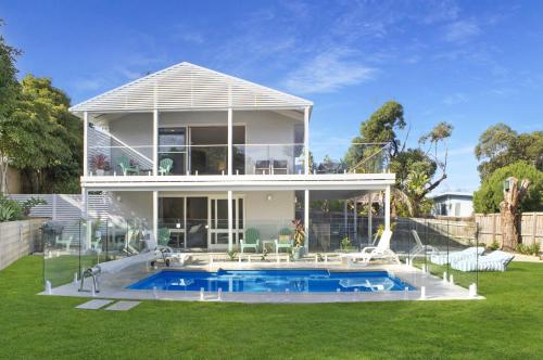 a house with a swimming pool in the yard at Riverview Retreat By Host on the Coast in Ocean Grove