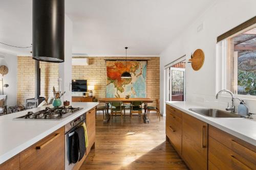 a kitchen with a sink and a stove top oven at Little Chill 4 Rosetta Tce Port Elliot - No Linen Included in Port Elliot