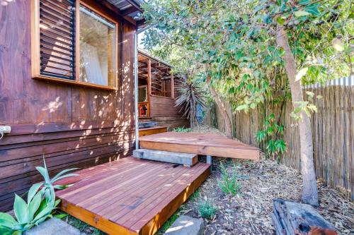a wooden deck on the side of a house at Little Chill 4 Rosetta Tce Port Elliot - No Linen Included in Port Elliot