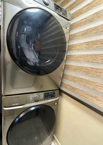 a washing machine is sitting in a room at Ocean Luxe in Paradise - Le Paradis Royal in Rincon