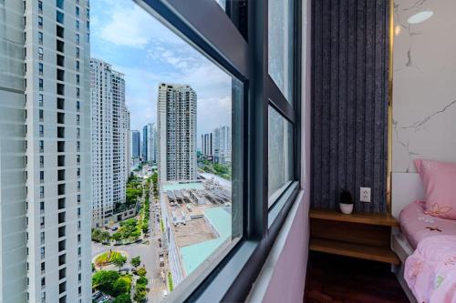 a room with a window with a view of a city at Spacious 2 Bed Rooms Condo in Masteri Thao Dien in Ho Chi Minh City
