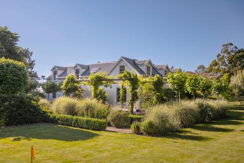 a house with a garden in front of it at Ranginui Retreat in Masterton