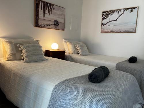 Ένα ή περισσότερα κρεβάτια σε δωμάτιο στο Eleven - Oceanside Retreat Busselton