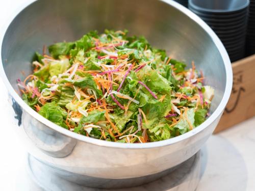 a salad in a metal bowl on a counter at Super Hotel Premier JR Nara Eki in Nara