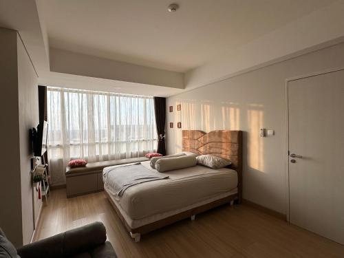 Tempat tidur dalam kamar di Apartment skandinavia