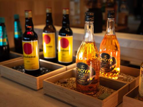 a group of bottles of beer sitting on a counter at Super Hotel Premier JR Nara Eki in Nara