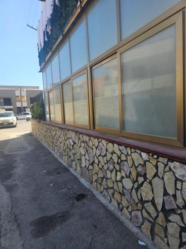 a building with a bunch of windows on it at A casa di Livia in Villabate