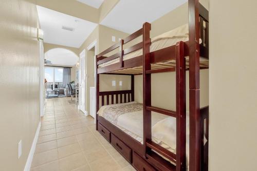 a bedroom with two bunk beds and a hallway at K and J Orlando in Orlando
