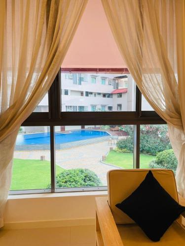 a large window with a view of a building at Oceanfront Galle by ICC in Galle
