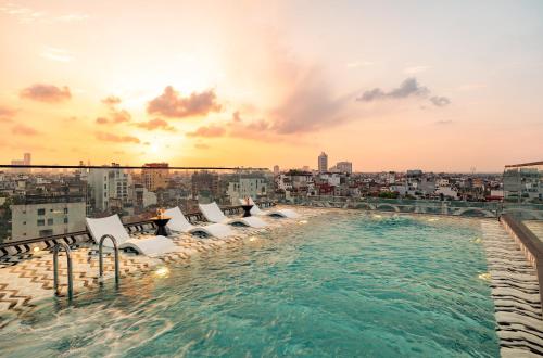 a swimming pool on the roof of a building at CLASSYC Hotel in Hanoi