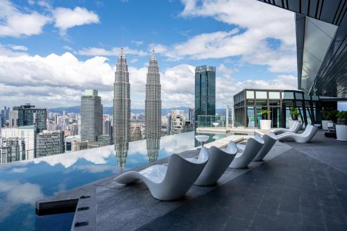 a view of the petronas twin towers from a building at Imperial Lexis Kuala Lumpur in Kuala Lumpur