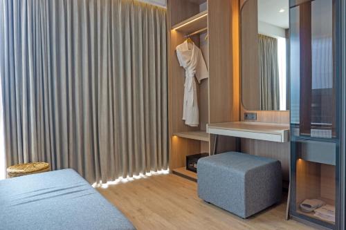 Postel nebo postele na pokoji v ubytování Golden Tulip Springhill Lampung