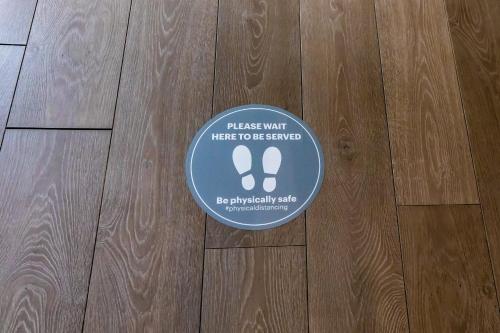 a sticker on a floor with a pair of footprints at Holiday Inn Express Norwich, an IHG Hotel in Norwich