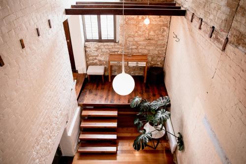 an overhead view of a loft with stairs and a light at Inner-city sanctuary with off-street parking in Hobart
