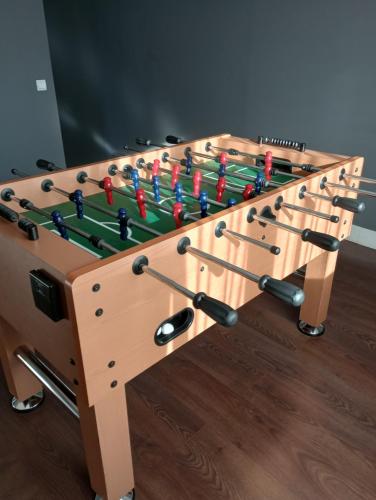 a large wooden game table with at Vila Gosen in Şard