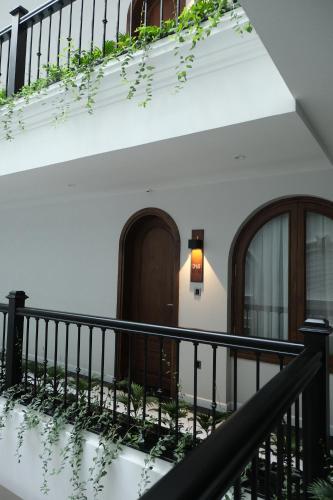 a stairway leading to a building with a door at Paul Chabot Hotel in Hai Phong