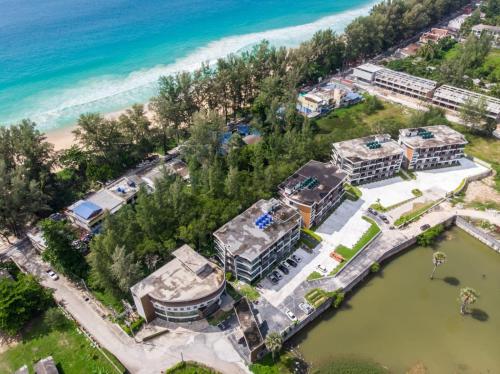 an aerial view of a resort next to the beach at Naithon Beachfront Condotel in Nai Thon Beach