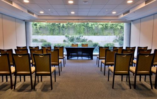 a conference room with a table and chairs at Holiday Inn Santiago - Airport Terminal by IHG in Santiago
