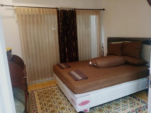 Ένα ή περισσότερα κρεβάτια σε δωμάτιο στο Villa Tombo Sayah