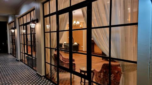 a room with a bed through a glass window at Marten's Wilderness Retreat in Lansdowne