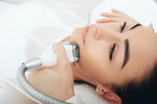 a woman getting her face rejuvenated with a hair dryer at Grandhotel Pupp in Karlovy Vary