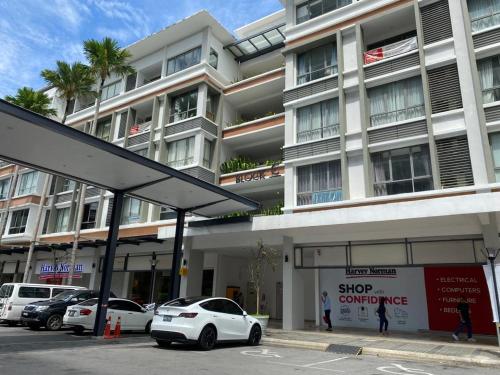 a white car parked in front of a building at MiriTimesSquare DAJ#4 Free WI-FI in Miri