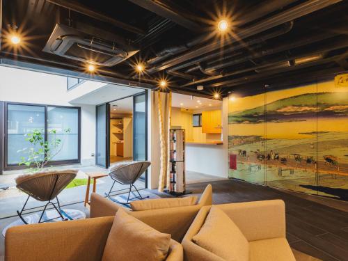 a living room with a couch and a table at Giappo Franca Kyoto in Kyoto