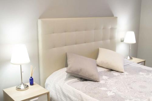 Postel nebo postele na pokoji v ubytování Apartamenticos Plaza Las Armas