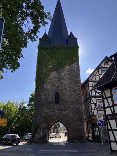 a tall building with a tower with a top at Castrum Visum Wernigerode in Wernigerode