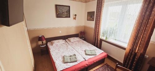 Postel nebo postele na pokoji v ubytování Willa Aida