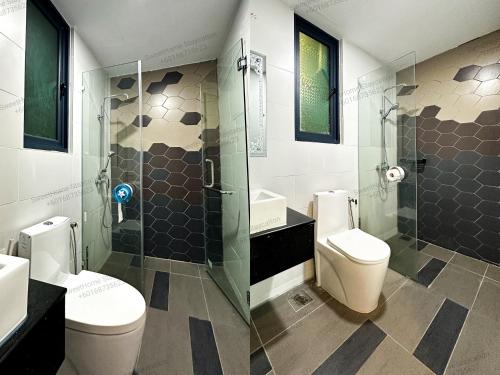 a bathroom with two toilets and a glass shower at Kuching Vivacity Jazz 1 Netflix in Kuching