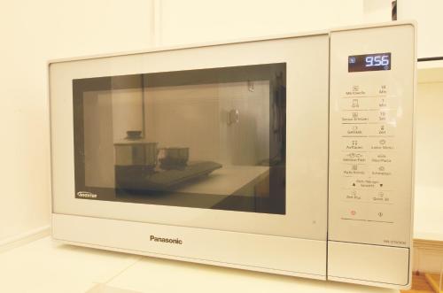 a microwave oven with a object inside of it at Clementine - Private Studio 50m from Centre Ville in Lauris