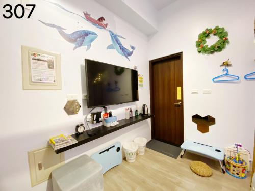 TV a/nebo společenská místnost v ubytování Wind Natural Parent-Child Inn II