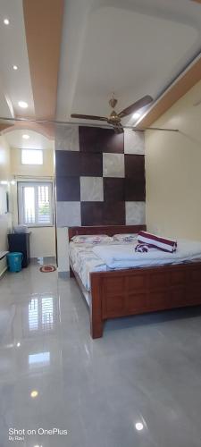 a bedroom with a bed in a room at Archana palace hampi in Hampi