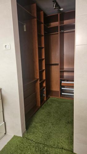 a walk in closet with a green rug at Beach House Lanzarote in Arrecife