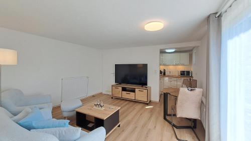 TV a/nebo společenská místnost v ubytování Ferienwohnung Gartenblick