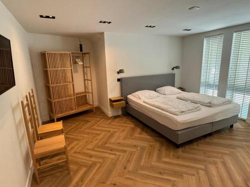 Ένα ή περισσότερα κρεβάτια σε δωμάτιο στο Vakantiewoning Oerd Ameland