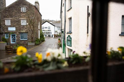 a view of a street from a window with flowers at Queens Head Inn & Restaurant in Hawkshead